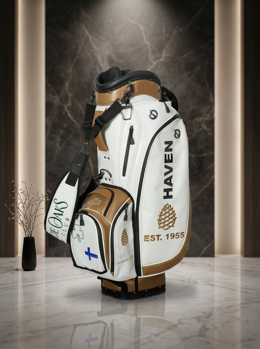 Individual golf story staff bag in saddle tan and ivory with crest
