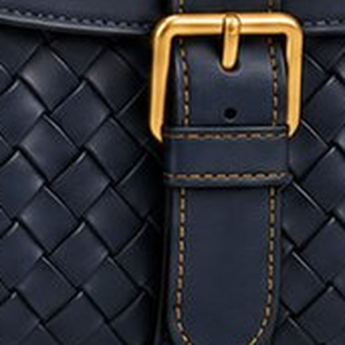 Gold hardware on ORKAI™ leather.